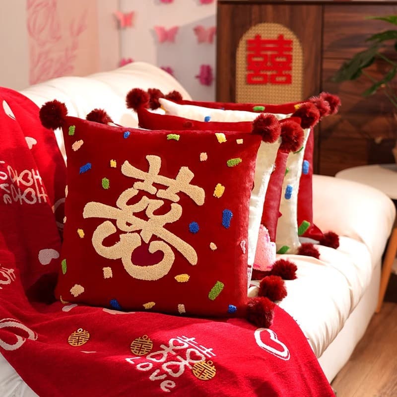 A pair of festive red wedding pillows for bed, living room, and bridal chamber decoration. A complete collection of wedding supplies.