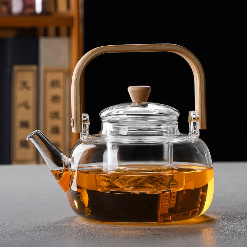 Stove tea brewing manufacturer wholesale, handle glass teapot, heat-resistant boiling and steeping pot, health tea for Pu'er and white tea.