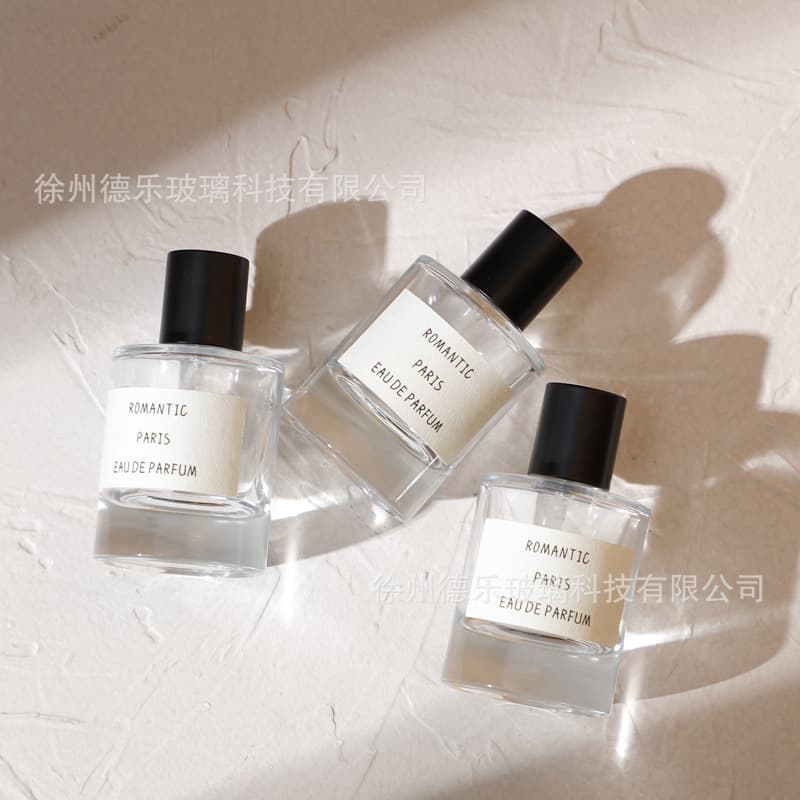 Wholesale 50mL thick bottom perfume bottle matte black cap glass perfume spray refillable bottle cylindrical empty perfume bottle