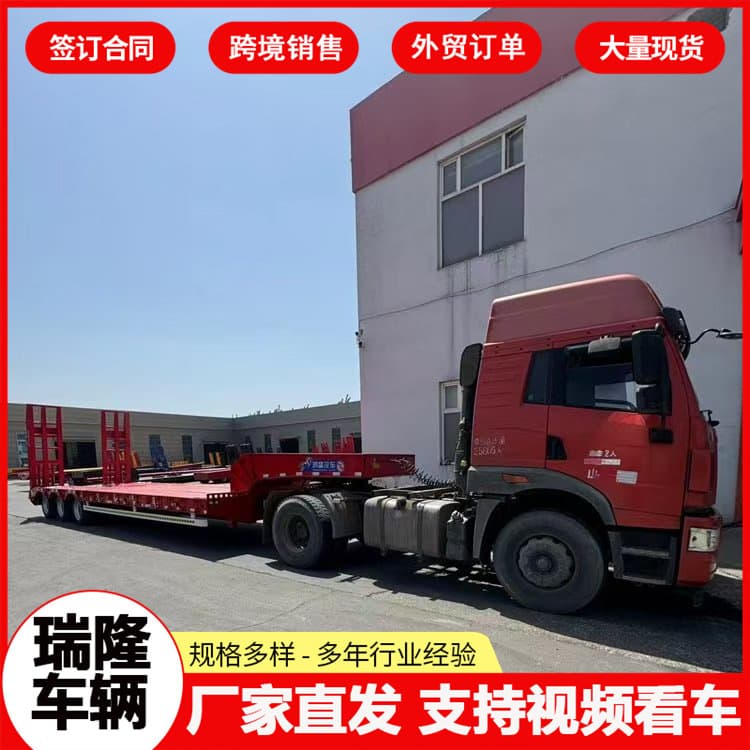 Low-bed semi-trailers for Africa and Middle East heavy machinery transport trailers, air-lift semi-trailers, and flatbed trailer attachments.
