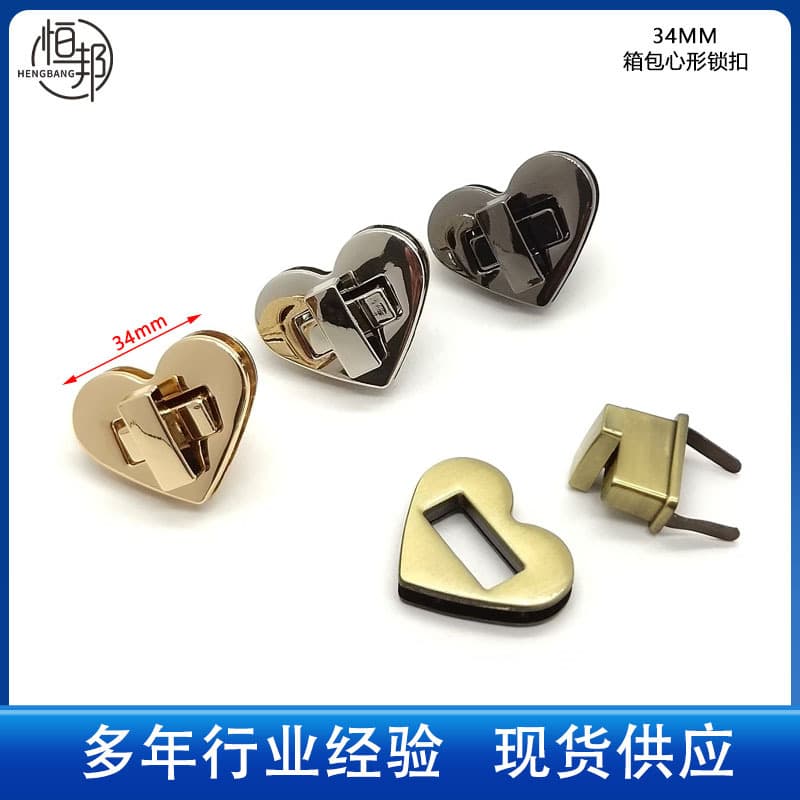 In-stock zinc alloy heart-shaped lock clasps for bags and leather goods hardware, metal twist lock lid knobs and clasps.