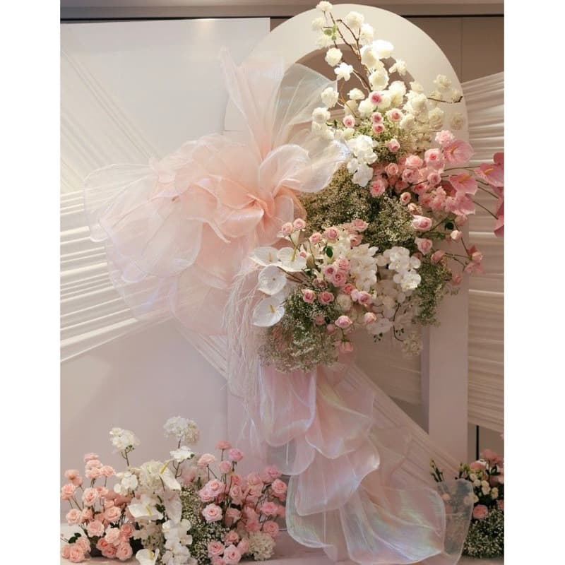 Giant floral arrangements for wedding decorations, silk organza floral arrangements, wedding backdrops, window displays, gauze flowers, and paper flowers.