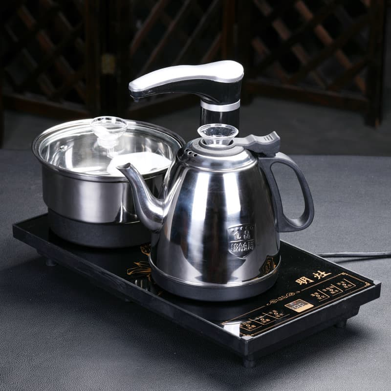 Black fully automatic electric kettle with built-in water boiler; smart electric kettle with fully automatic water filling and stainless steel hot water dispenser.