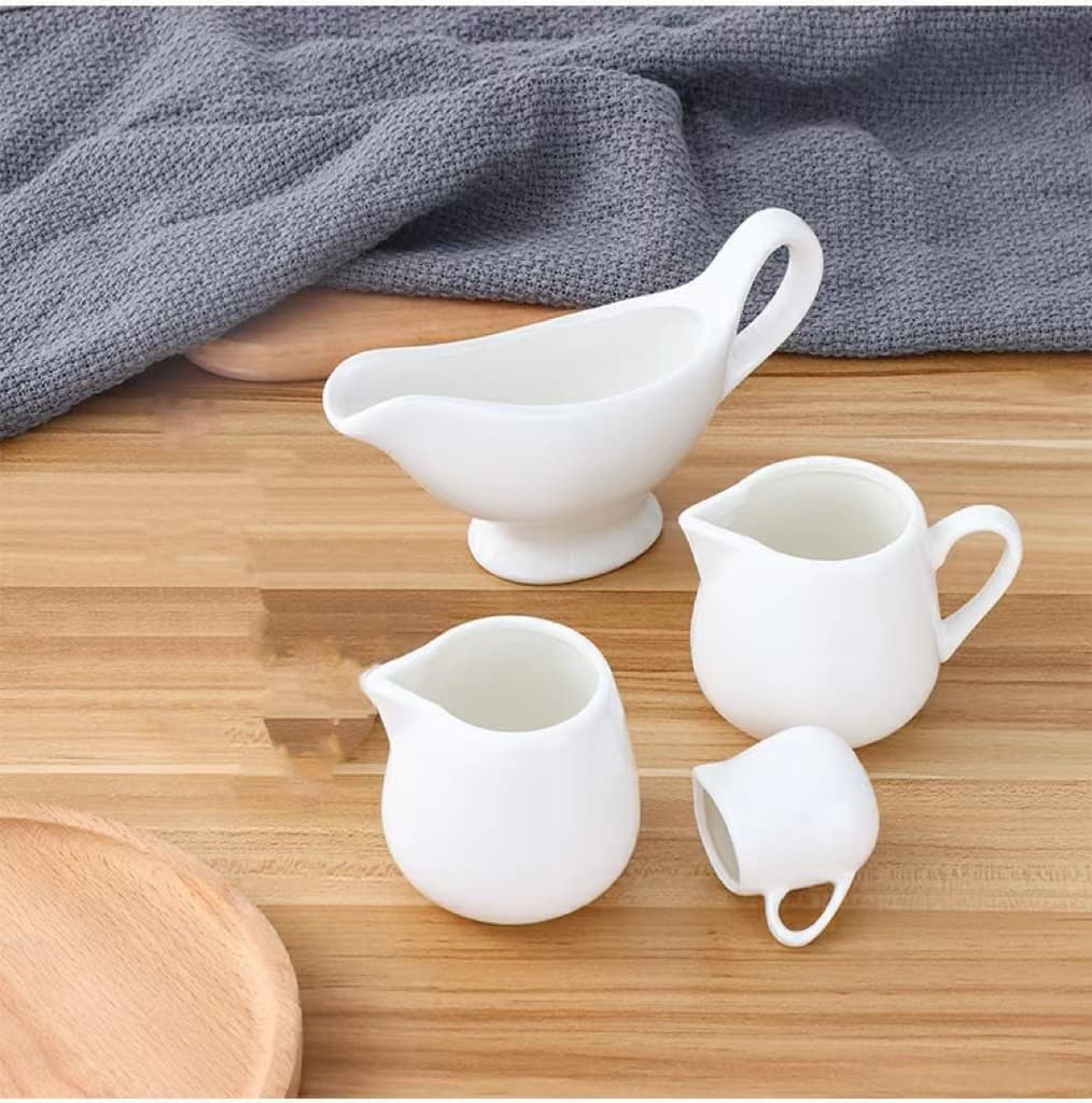 Ceramic milk spoon, milk jug, Western-style steak and black pepper sauce container, cooking utensils, coffee sugar cube bowl, milk jug.
