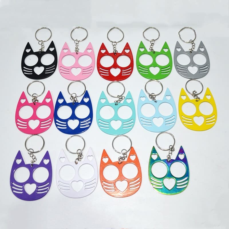 New brass knuckles, righteous black cat two-finger buckle, single-finger buckle, cute cat heart keychain, emergency window breaker for self-defense.