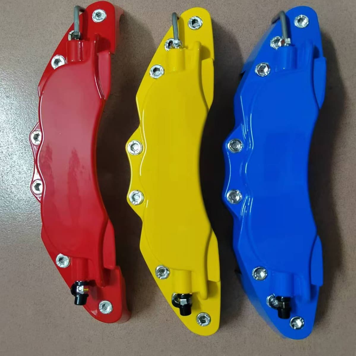 Universal metal adjustable logo caliper cover and wheel hub cover for cars.