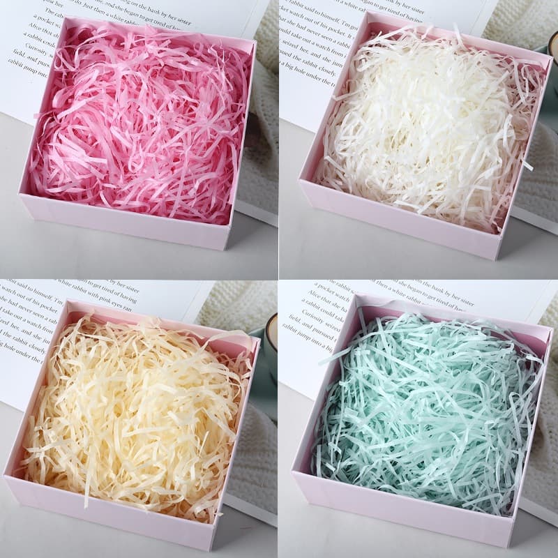 Factory wholesale raffia paper shreds for gift boxes, candy boxes, decorations, and fillings. Large stock of shredded paper strips available.