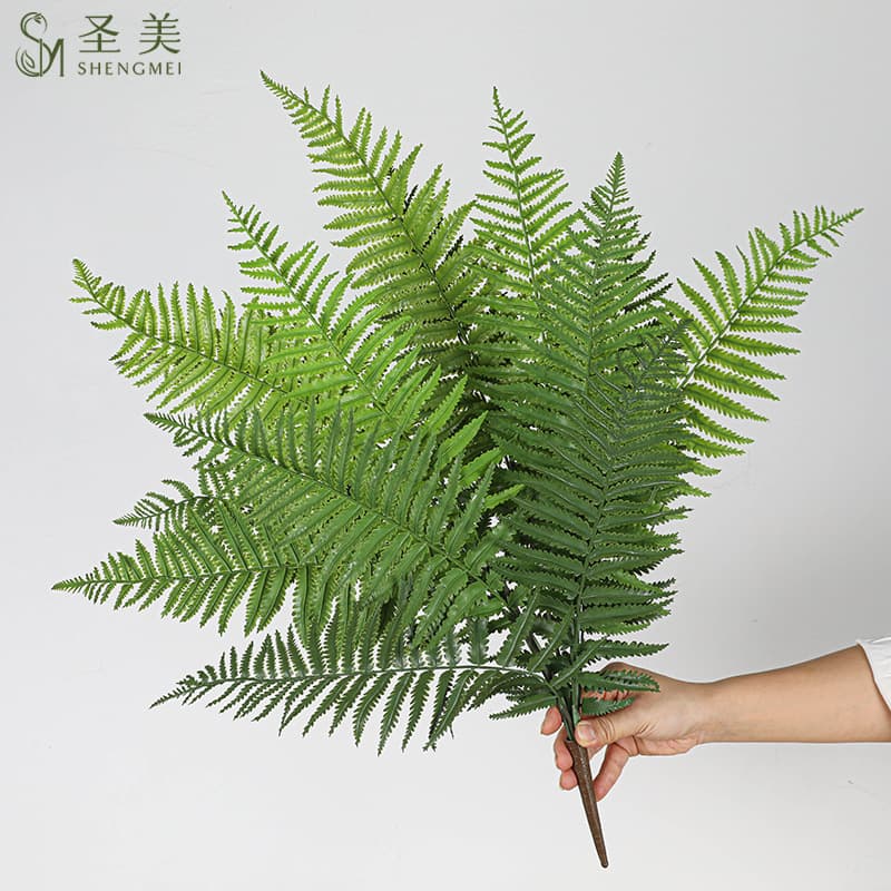 Large artificial ferns, including bundles of ferns, kidney ferns, asparagus ferns, and wire mesh ferns, are used for decorative landscaping.