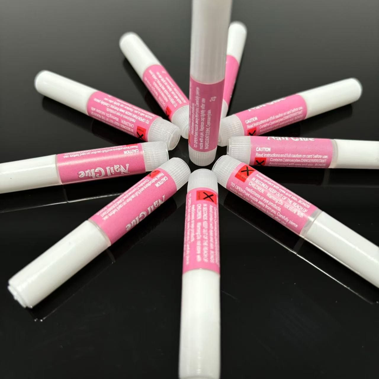 Yiwu manufacturer in-stock 2g red tube nail glue, quick-drying nail glue for press-on nails, rhinestone glue, false nail glue