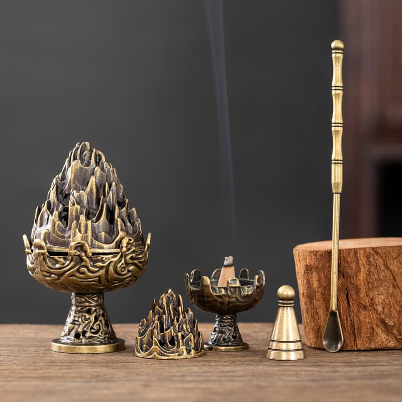 Retro Boshan burner set with pagoda incense seal mold and spoon trio, for sandalwood and agarwood powder.