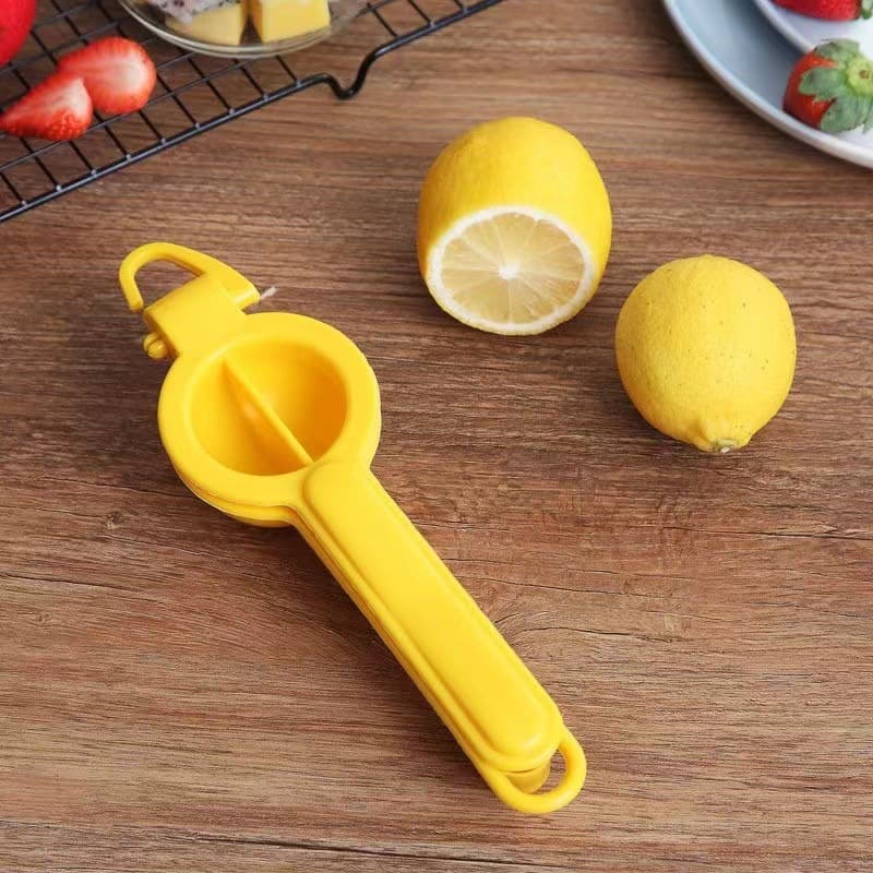 Multifunctional lemon tongs, hand-operated creative kitchen gadget, simple manual fruit and lemon juicer for home use.