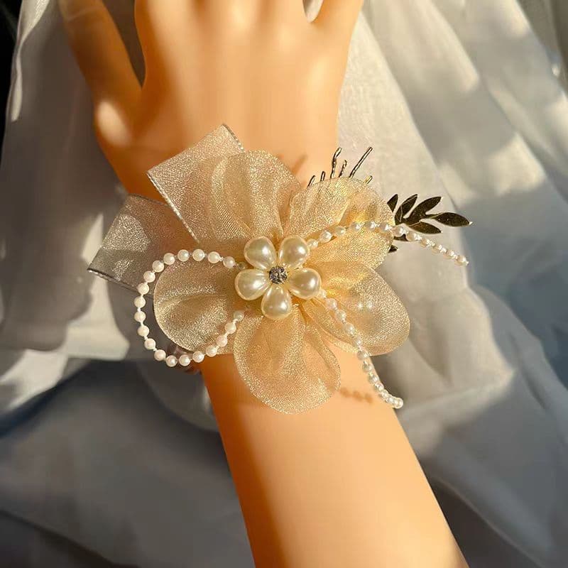 Wedding bridesmaid wrist flowers in champagne and romantic pink, bridal sisterhood hand-tied flowers, children's activity hand flowers.