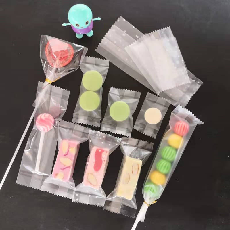 Lollipop button biscuit packaging bag, transparent machine-sealed bag, sealed and repackaged nougat small package, self-sealing