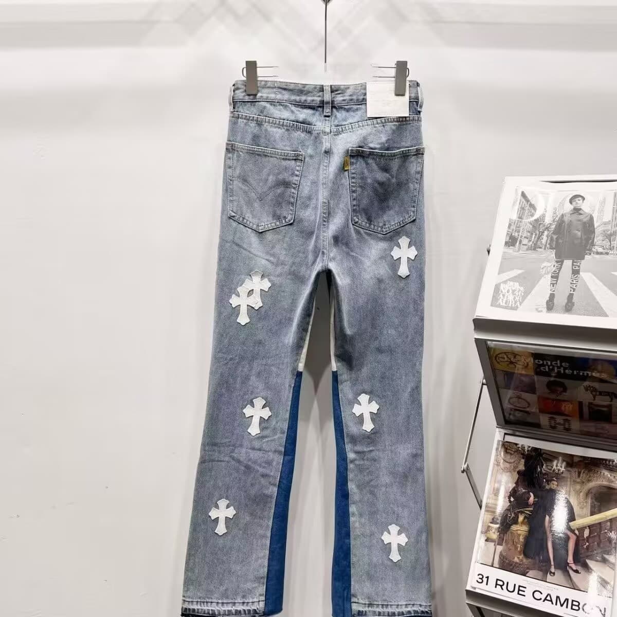 High street trendy brand loose spliced cross crotch jeans 2026 leather washed flared washed micro trousers