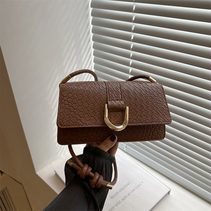 Temperament woven pattern small square bag for women 2025 summer new texture fashion handbag commuter single shoulder armpit bag