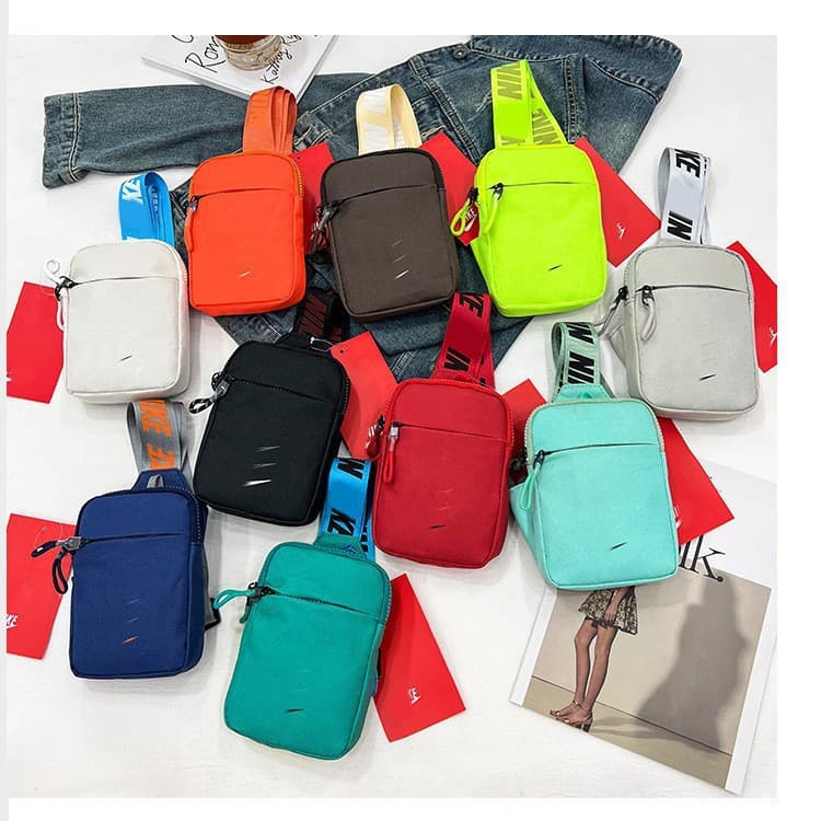 Manufacturer's new summer mobile phone bag for men and women, trendy brand letter wide shoulder strap, casual versatile crossbody bag canvas small