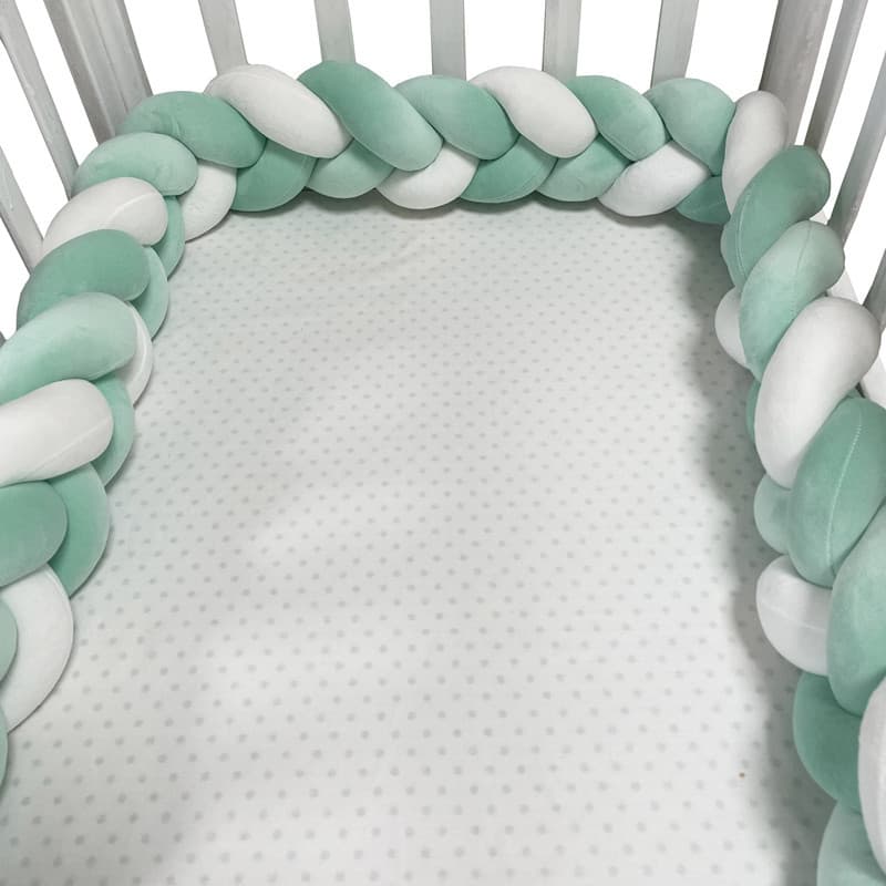 New Instagram-worthy handmade woven long strip baby crib bumper with knotted balls, three-strand braided texture, soft padded for added protection.