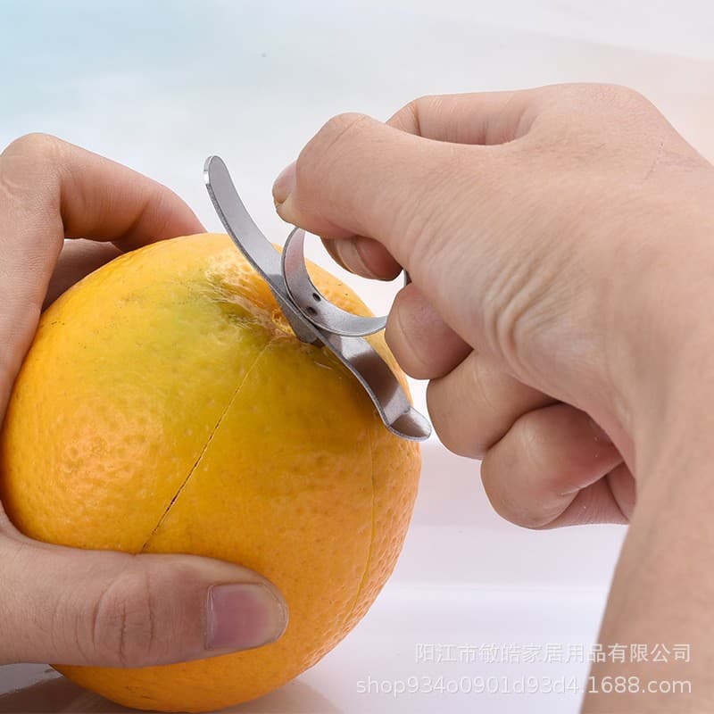 Stainless steel ring-style orange peeler with snail-shaped design, dual-purpose for pomelos and pomegranates