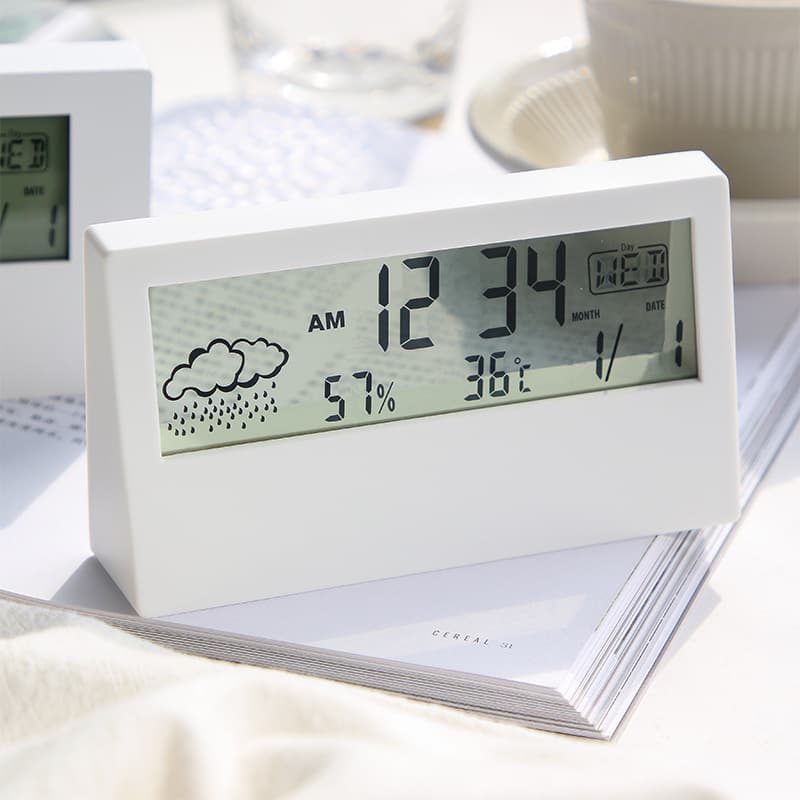 Cross-border recommended transparent case electronic alarm clock with hygrometer, clock, creative weather display, and night light.