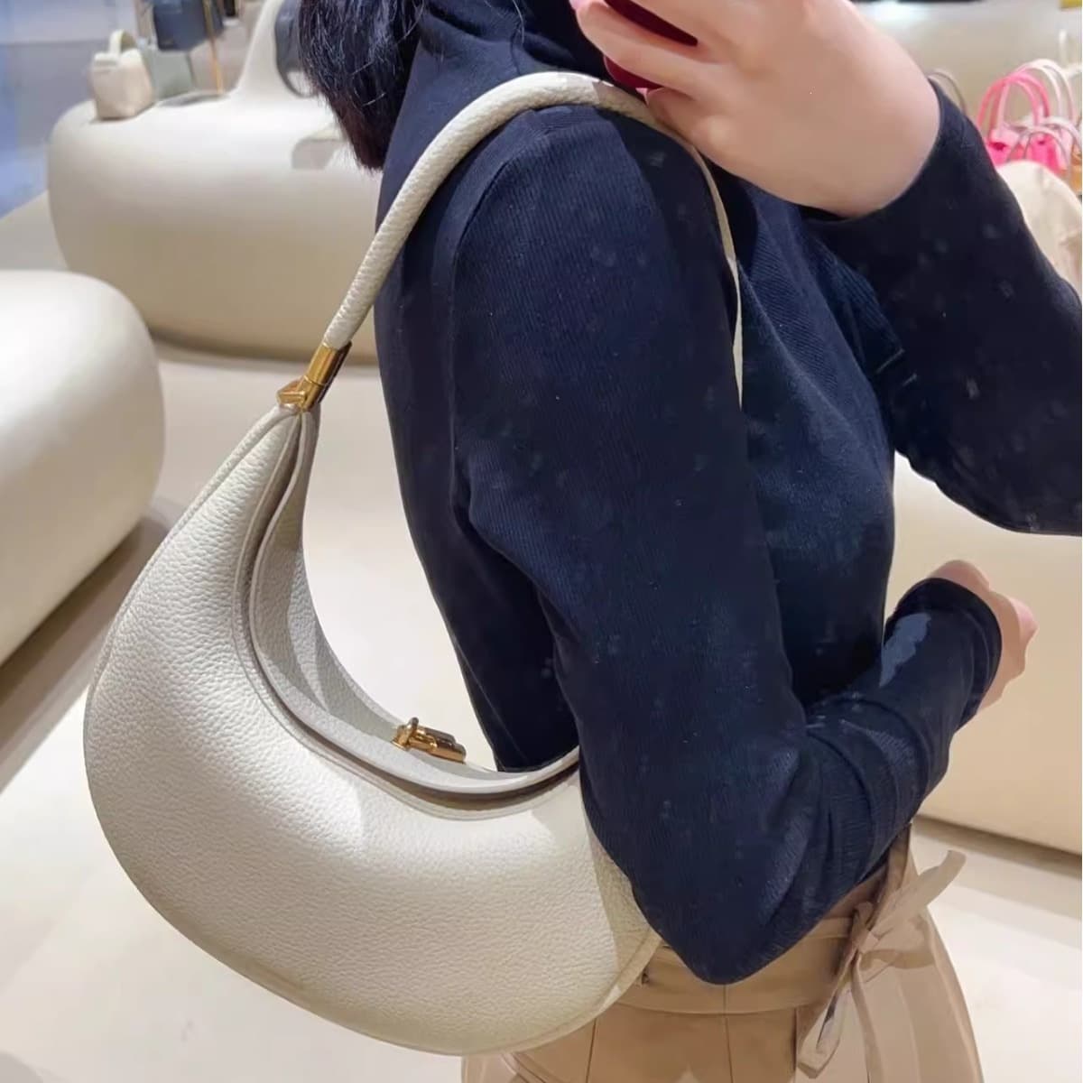 Light luxury and high-end portable shoulder bag, fashionable niche solid color portable crescent bag, versatile commuter handbag for women
