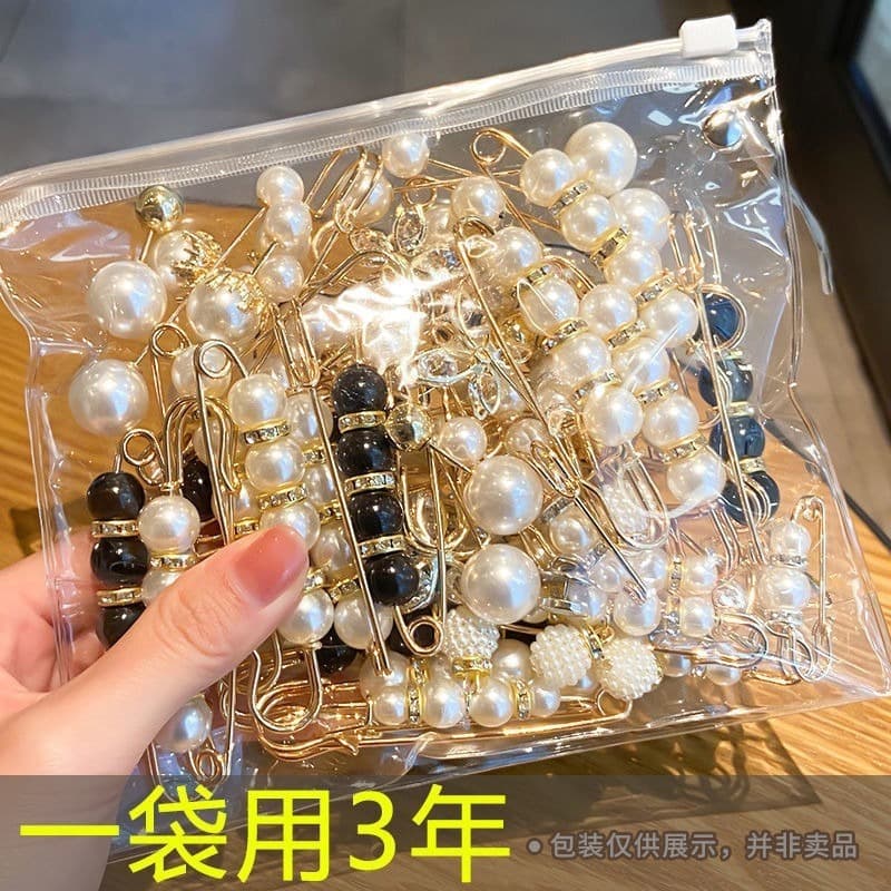 Waist-cinching clip for pants adjustment, anti-wardrobe malfunction brooch clasp, skirt regulator, and gathering pin.