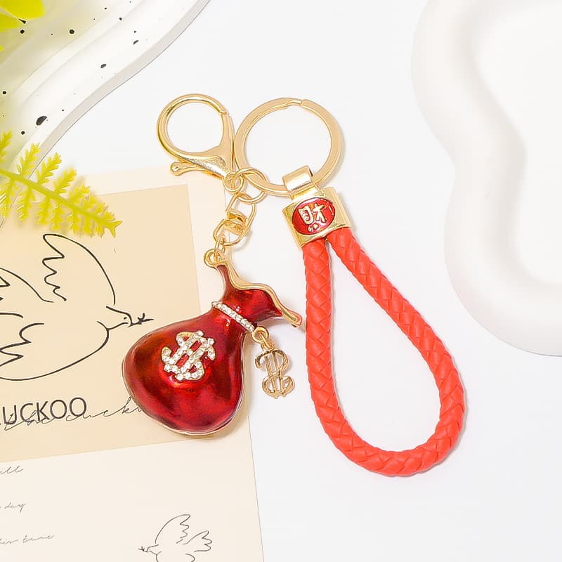 Oil dripping dollar money bag keychain ring rhinestone metal key pendant lucky leather rope lucky bag Yiwu small commodities