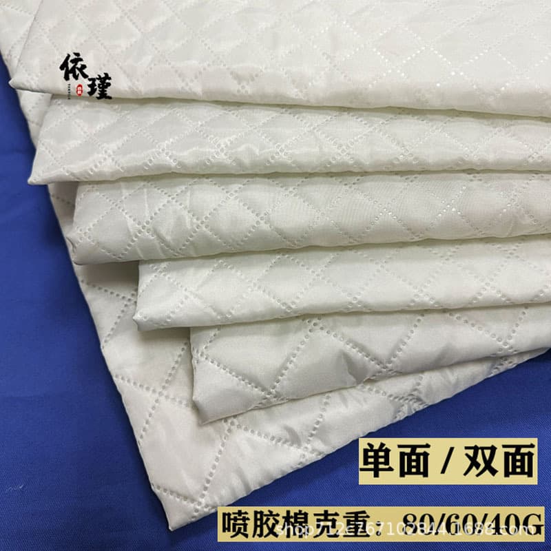 Double-sided double-layer taffeta ultrasonic quilted fabric for comfortable pillow inner cases, interlined with small check patterned cotton.