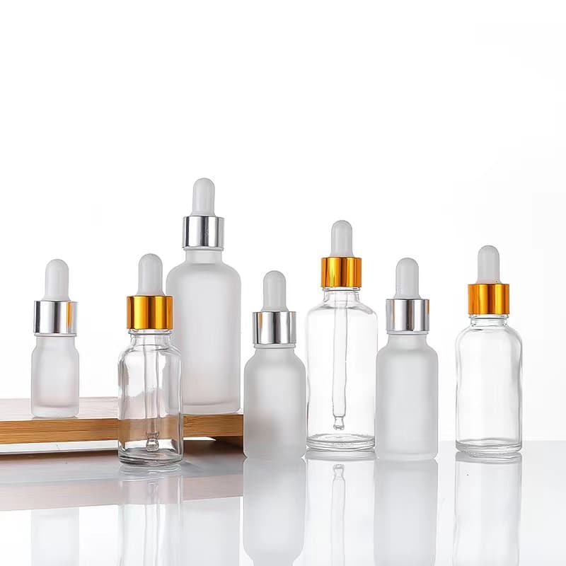 Wholesale transparent glass dropper bottles, frosted essential oil bottles, 10ml cosmetic serum dispensing vials, empty small bottles