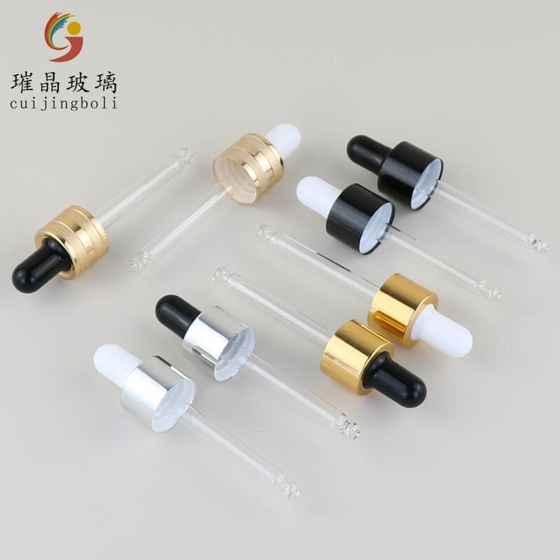 In stock: 18-thread electroplated aluminum collar caps in gold, silver, and black with silicone rubber-tipped glass dropper lids for essential oil bottles.