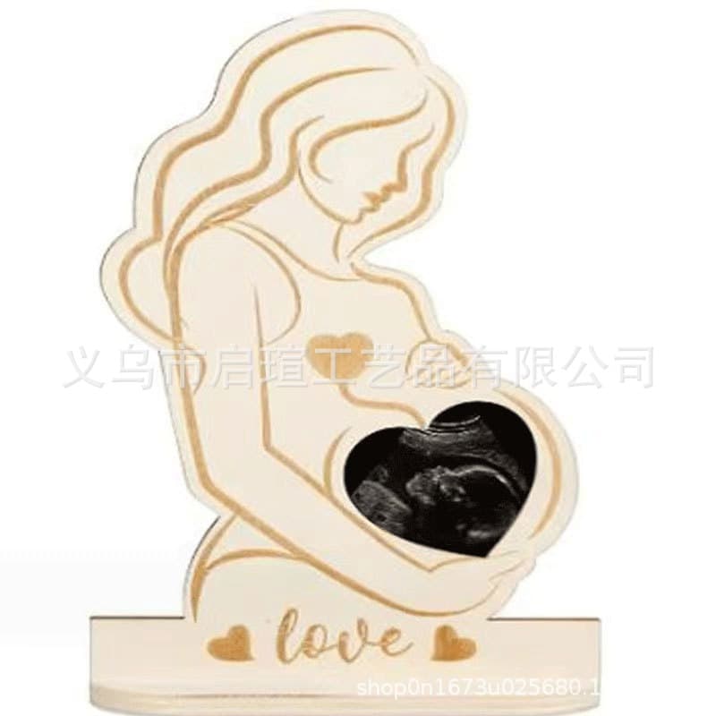 Handicraft ornaments stand to commemorate the birth of the baby. Baby ultrasound test B-ultrasound to commemorate pregnant mothers in stock.