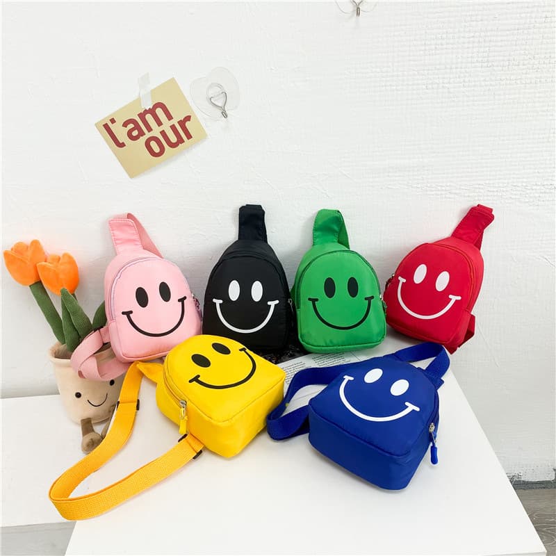 Children's bag with smiley face design, 2025 new style, nylon trendy boy's chest bag, kindergarten baby's backpack for girls.