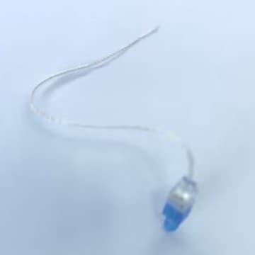 Hearing aid accessories: speaker chamber, wires, thin tubes.