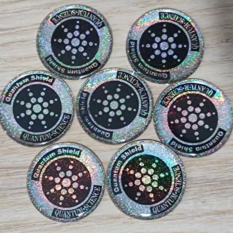 The price includes outer packaging, negative ion phone sticker (gold/silver), and anti-wave radiation energy phone sticker.