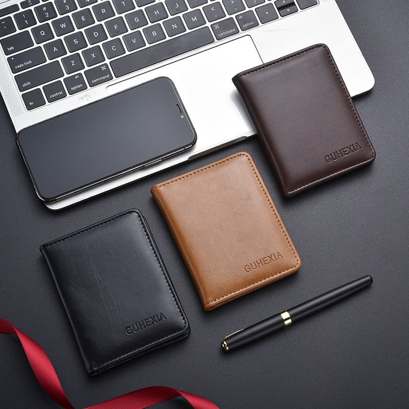 Factory wholesale simple ultra-thin solid color short women's wallet multi-functional genuine leather texture wallet men's wallet