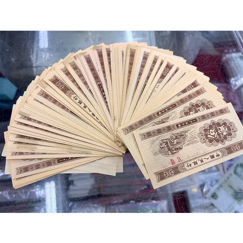 One fen (0.01 yuan) RMB brand new banknotes, genuine, whole bundle of 100 sheets with same serial numbers, slight oil stains, 1953 one fen special offer.