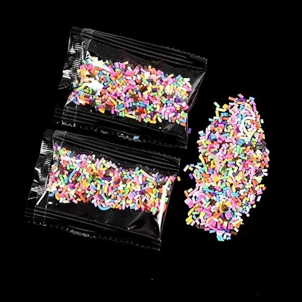 DIY butter glue hair clips and phone cases materials; handmade butter glue embellishments, fillings, sugar granules, and chocolate shreds.