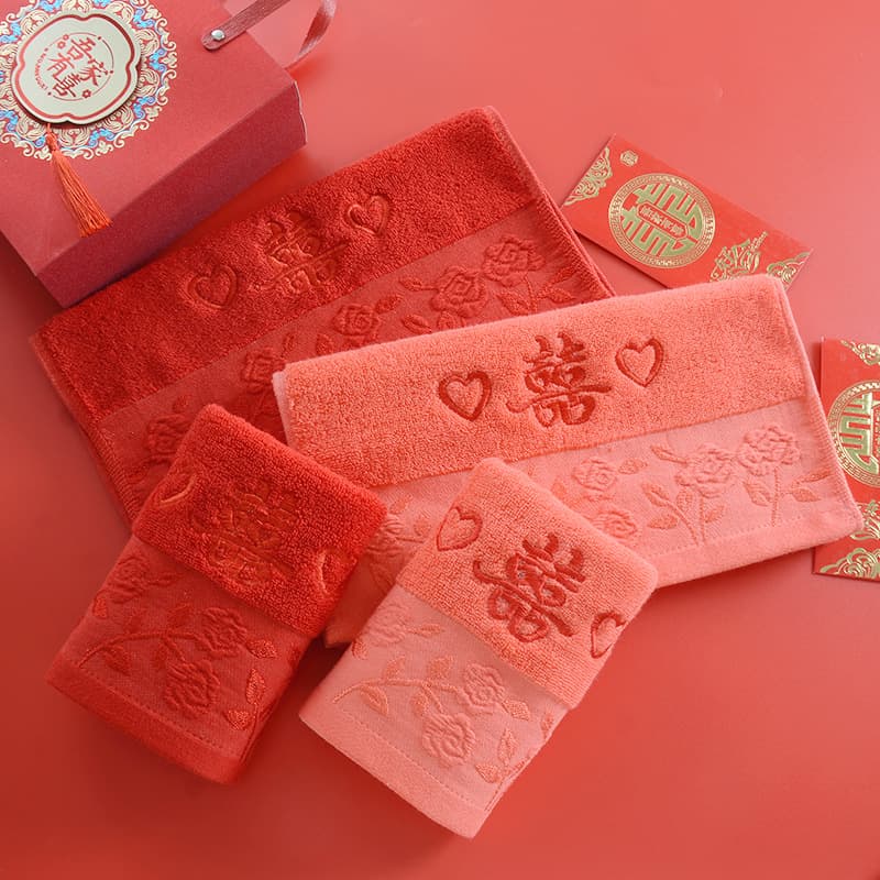 Direct sales wedding towels with rose embroidery and double happiness design, available in red and pink for marriage favors and souvenirs.