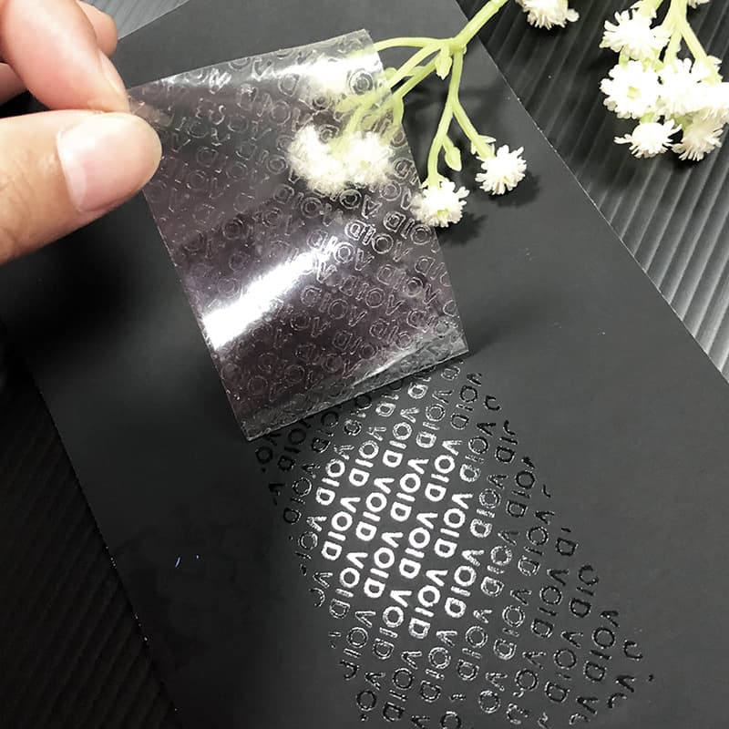 Transparent VOID anti-counterfeiting label material PET round sticker raw material transparent waterproof self-adhesive roll packaging material