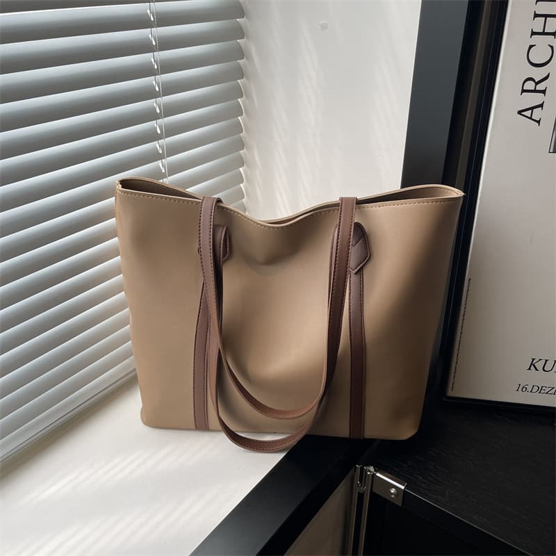 Korean version of large-capacity solid color bag for women 2025 autumn new fashion retro commuter tote bag simple shoulder bag