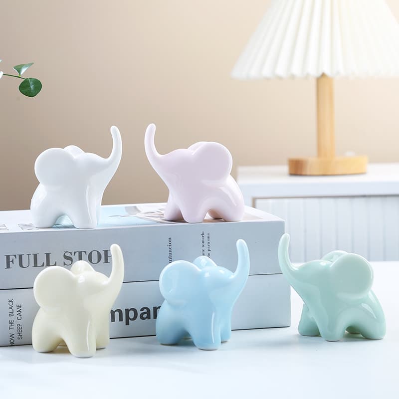 Ceramic miniature elephant tea pet ornament, simple design, auspicious elephant, lucky elephant, wealth-attracting ornament, Zen-inspired decorative ornament.