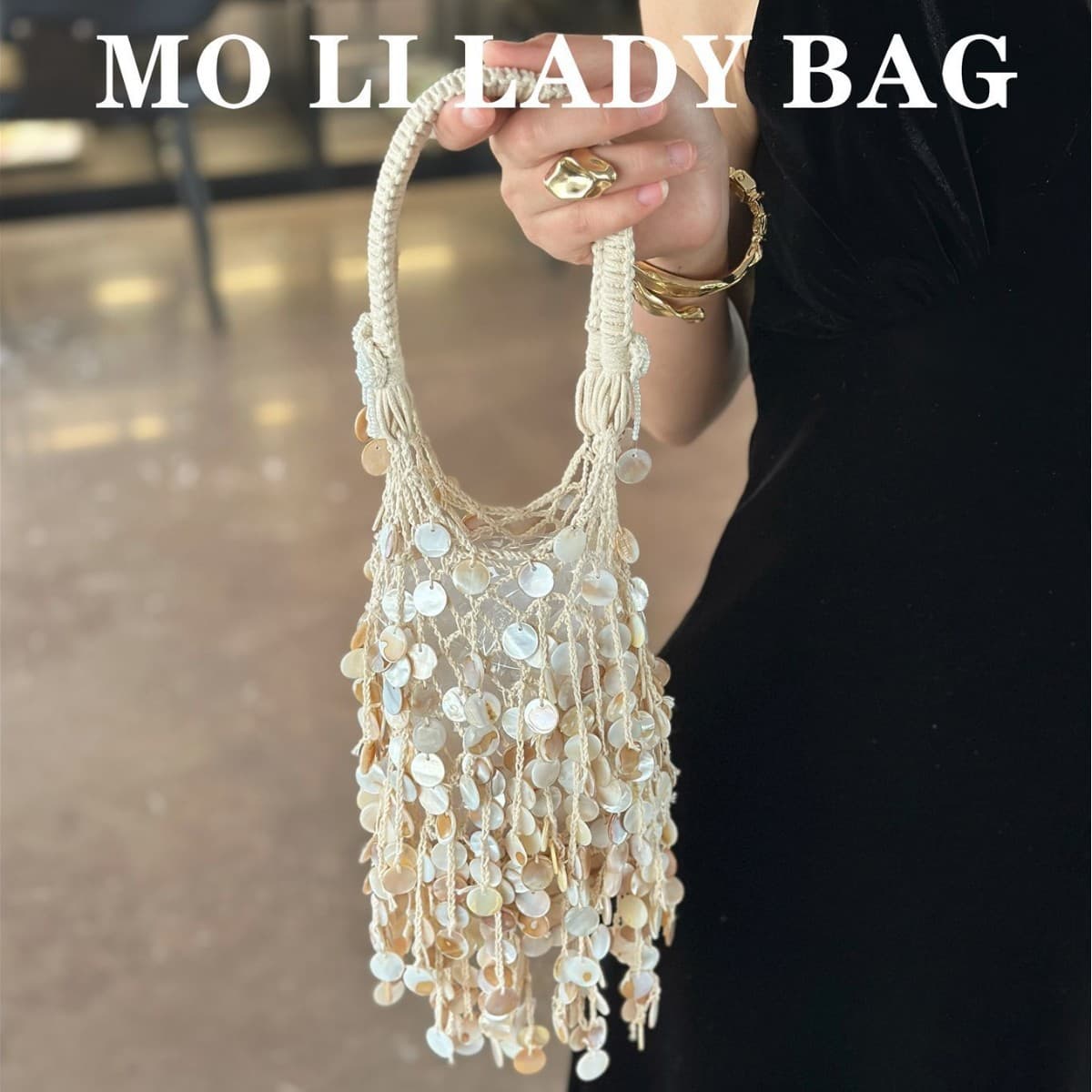 2026 New French Retro Shell Sequin Woven Bag Women's 2026 Spring Seaside Vacation Tassel Handheld Hollow Bag