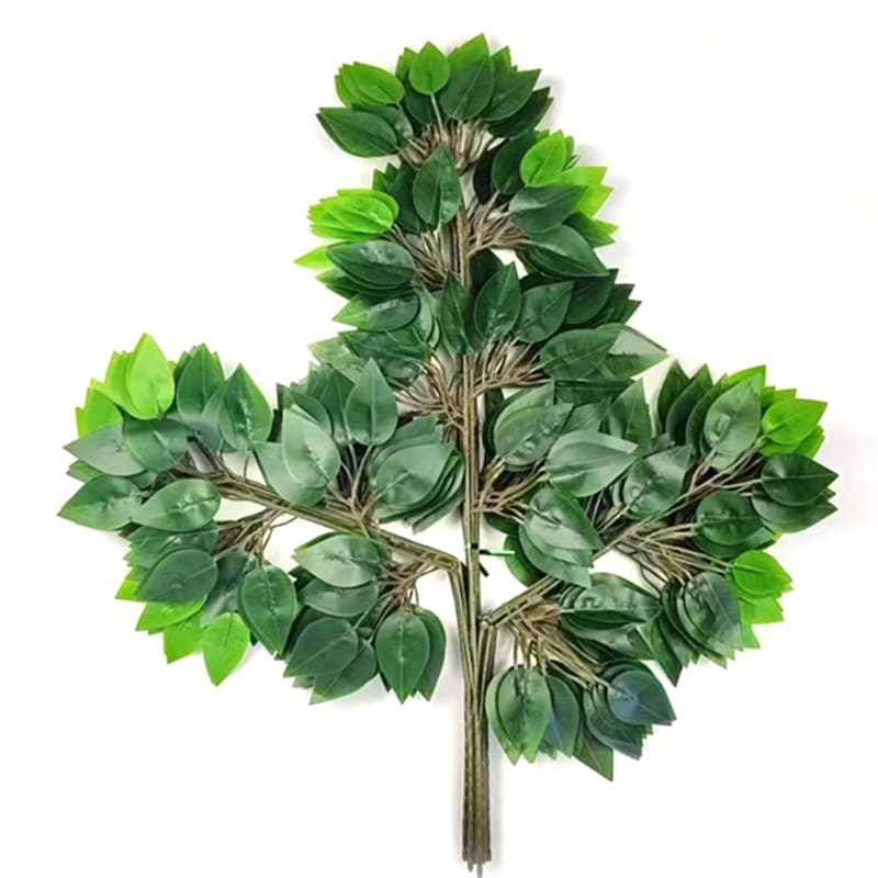 Simulated banyan tree branches and leaves, made of plastic with a tactile feel, are used for garden decoration.