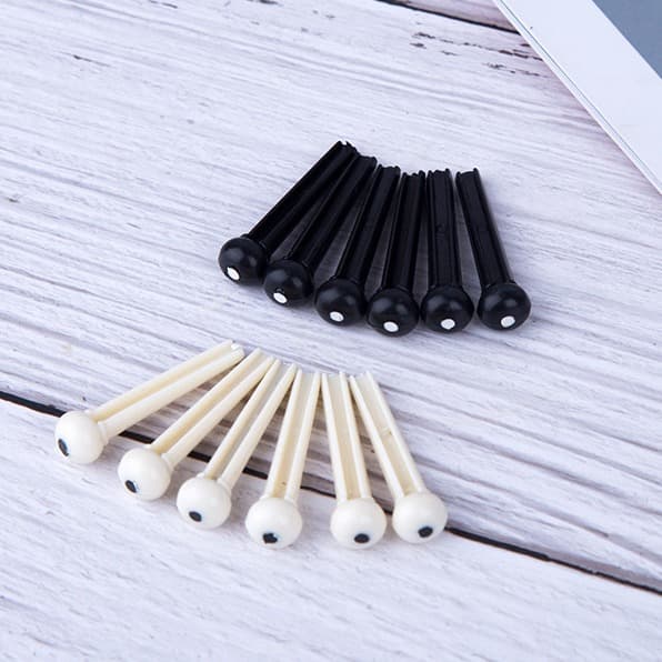 Cross-border wholesale guitar bridge pins for folk acoustic guitars, white and black solid pins, tail pins, and instrument pegs