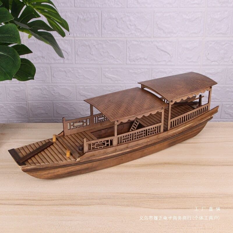 Antique wooden boats from the water towns of Jiangnan, China, resembling those of Shaoxing, or awning boats that can float on water; decorative crafts and ornaments.