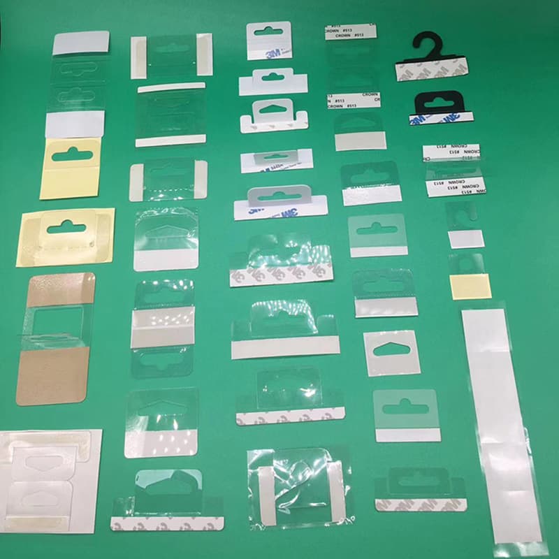 Manufacturer wholesale self-adhesive PP aircraft hole hanging head self-adhesive PET aircraft buckle hook color box hook