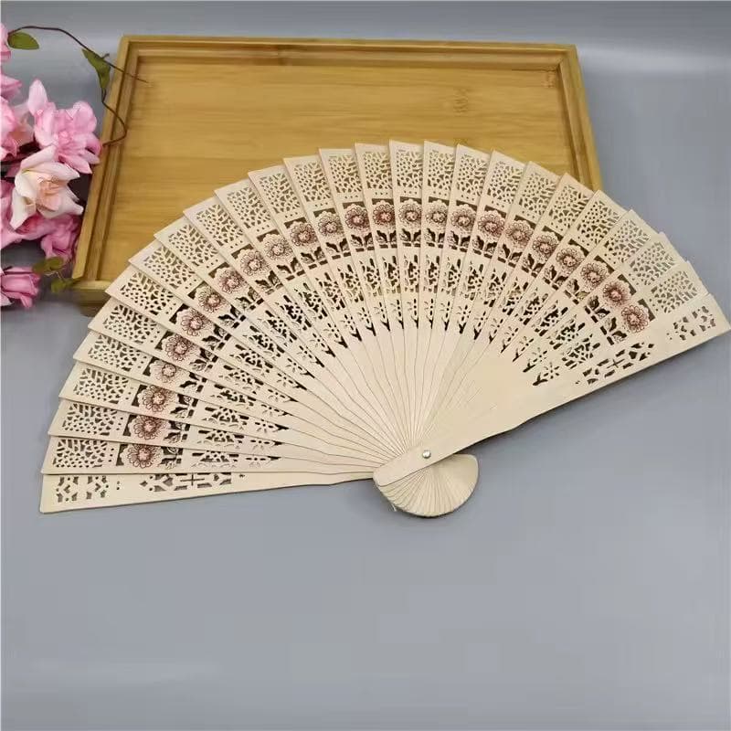 This sandalwood-scented folding fan is perfect for women, ideal for photos, and a stylish gift. It features a unique openwork design and is made of wood.