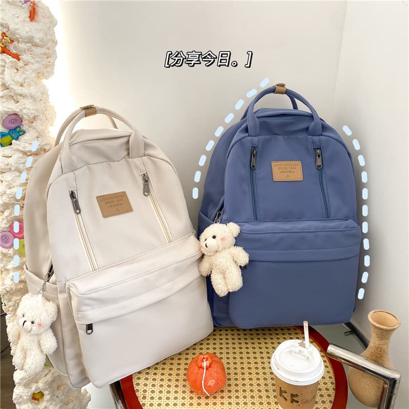 Schoolbag female junior high school student middle school student large capacity backpack travel college student simple ins versatile boy backpack