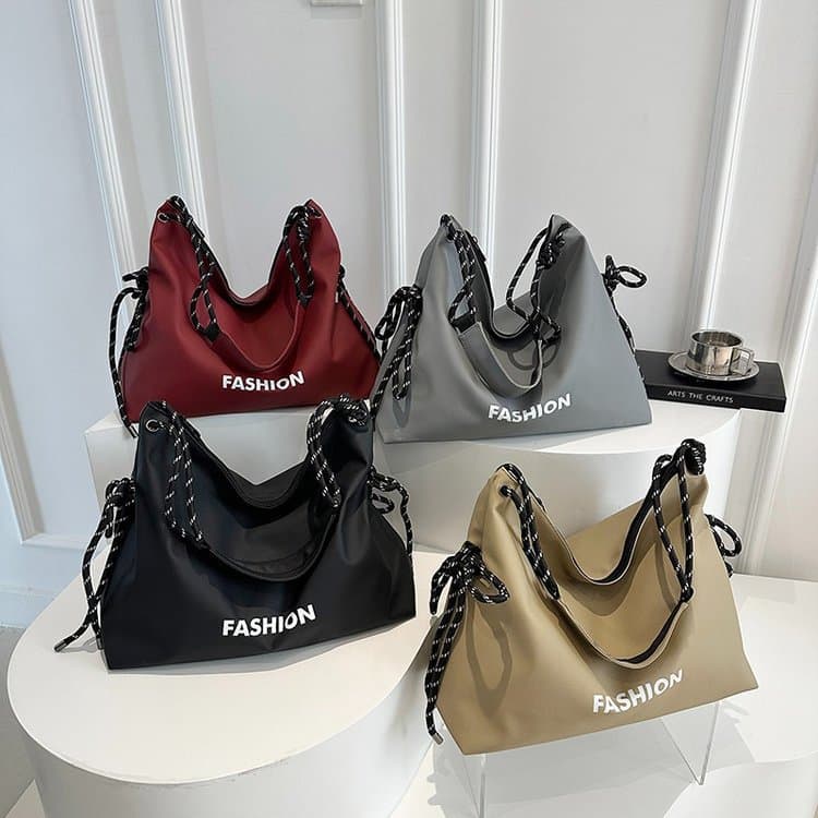2025 New Oxford Cloth Women's Bag Large Capacity Casual Commuter Large Bag Japanese Korean Versatile Letter Drawstring Crossbody Bag