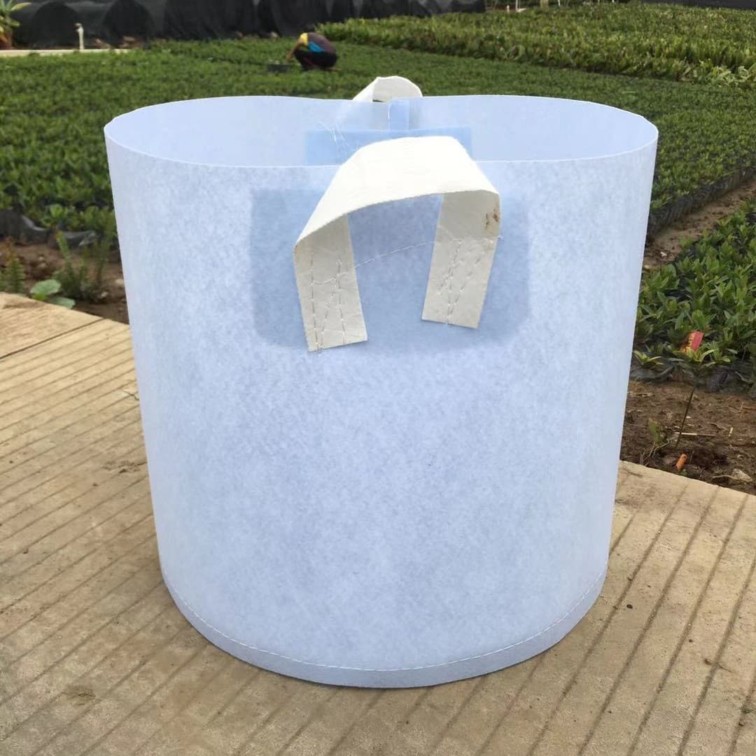 Manufacturer supplies non-woven thickened planting bags, gardening white seedlings, flower transplants, tree planting bags, seedling bag handles