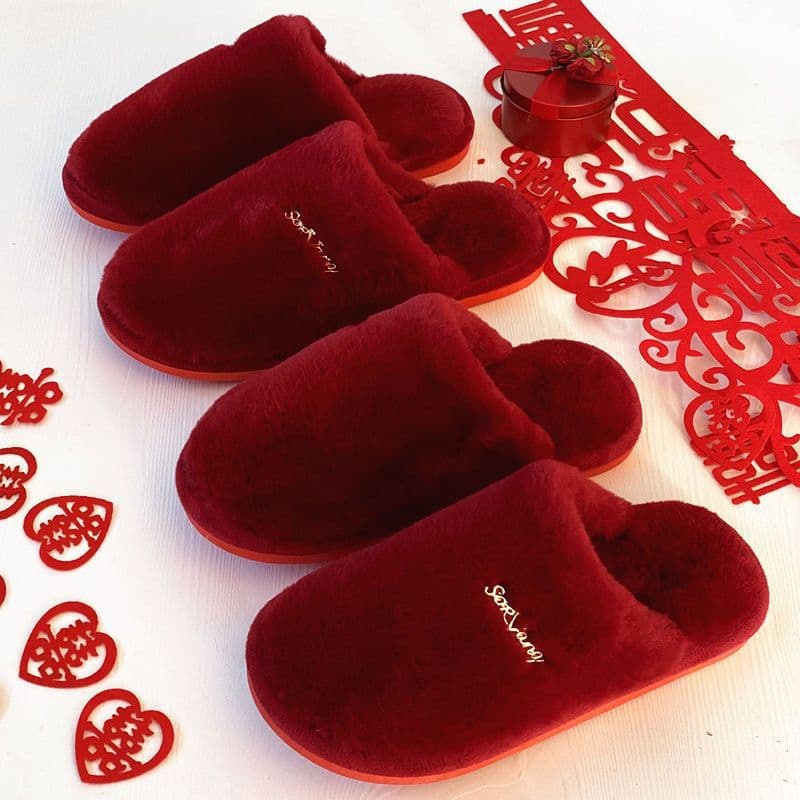 Plush red couple's home festive slippers, a pair for indoor wedding, zodiac year, couple's wedding celebration, and dowry item.